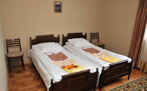 Postel nebo postele na pokoji v ubytování Hotel Elegant