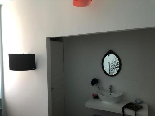 a bathroom with a sink and a mirror on the wall at Marevino in Levanto