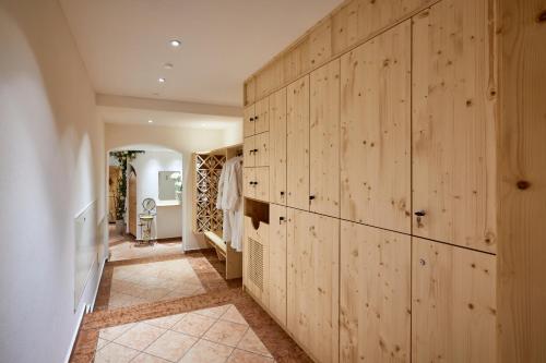 a hallway with wood paneled walls in a house at Hotel Erna in Colle Isarco