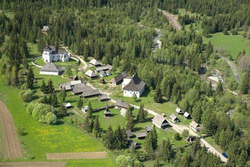 an aerial view of a village with houses and trees at Nina Liptov in Liptovský Ján