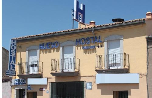 a building with a hospital sign on the side of it at Nuevo Hostal Paulino in Trujillo