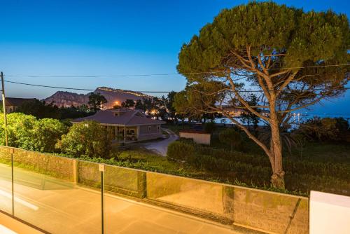 a view of a house with a tennis court at Vizantida Maisonette, By TK Property Management in Zakynthos Town