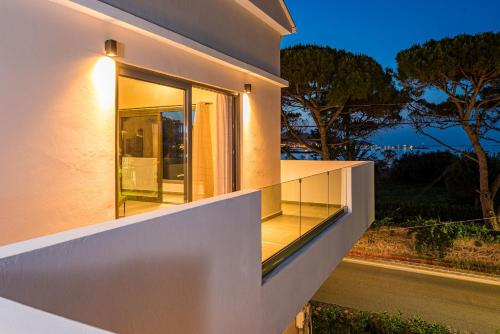 a window on the side of a house with a street at Vizantida Maisonette, By TK Property Management in Zakynthos Town