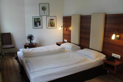Katil atau katil-katil dalam bilik di Hotel am Viktualienmarkt