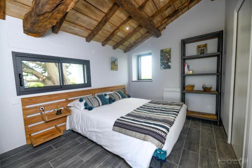 A bed or beds in a room at Gites De La Grande Borderie