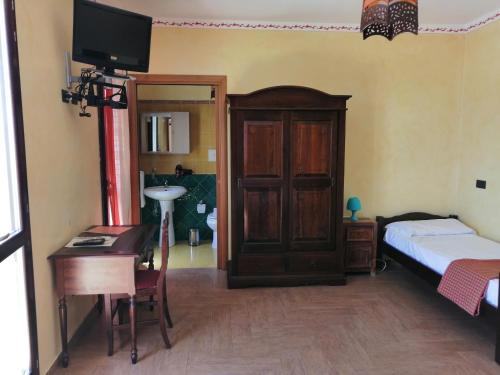 Cama o camas de una habitación en B&B Donna Sabella