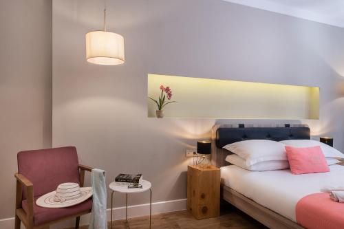 Ένα ή περισσότερα κρεβάτια σε δωμάτιο στο Viaggio Elegant Rooms