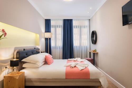 Ένα ή περισσότερα κρεβάτια σε δωμάτιο στο Viaggio Elegant Rooms