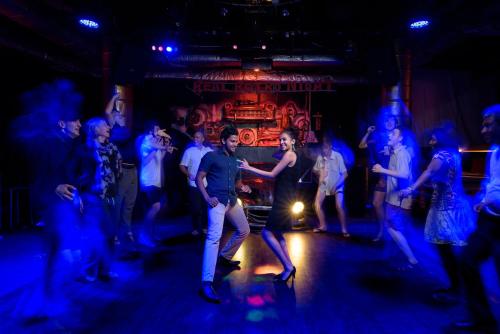 a group of people dancing in a nightclub at Amaya Hills Kandy in Kandy