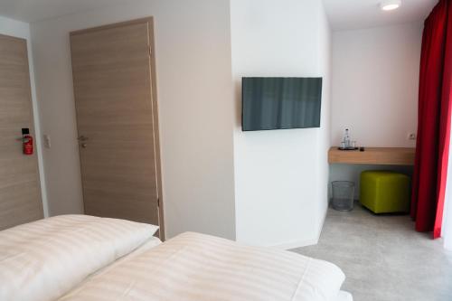 Letto o letti in una camera di Pension Haas-Hotel am Turm