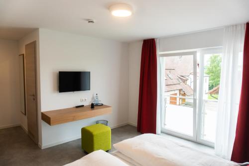 TV o dispositivi per l'intrattenimento presso Pension Haas-Hotel am Turm