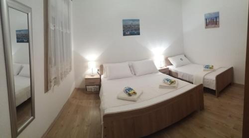 Postel nebo postele na pokoji v ubytování Apartment Nehaj