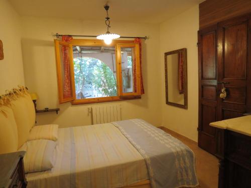 Ένα ή περισσότερα κρεβάτια σε δωμάτιο στο Le Case del Riccio - Isola d'Elba (049004LTN0006)