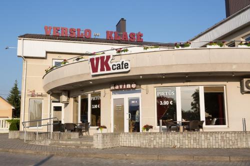 a view of a wix cafe with tables and chairs in front at Verslo Klasė-easy to stay in Panevėžys