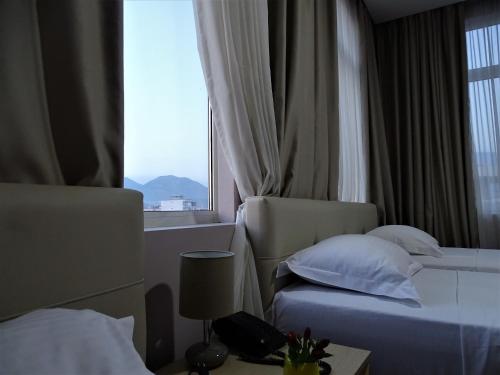Postel nebo postele na pokoji v ubytování Signature Idea hotel