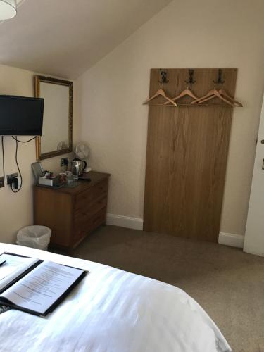 Ένα ή περισσότερα κρεβάτια σε δωμάτιο στο Ravenswood Guest House