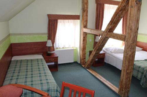 Ein Bett oder Betten in einem Zimmer der Unterkunft Willa Akme