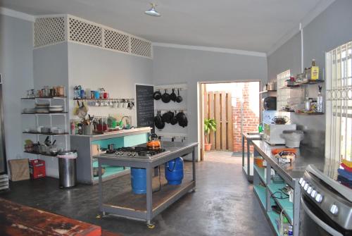 a kitchen with a table and a stove in it at Mobay Kotch in Montego Bay