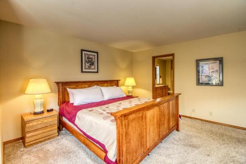 a bedroom with a large bed and a mirror at The Hawks Nest in Manson