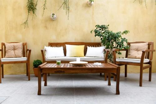 a living room with a couch and a coffee table at Anemi Deluxe Apartment in Kolios