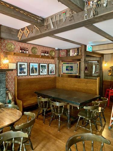 a dining room with a table and chairs at The Georgetown Inn in Canmore