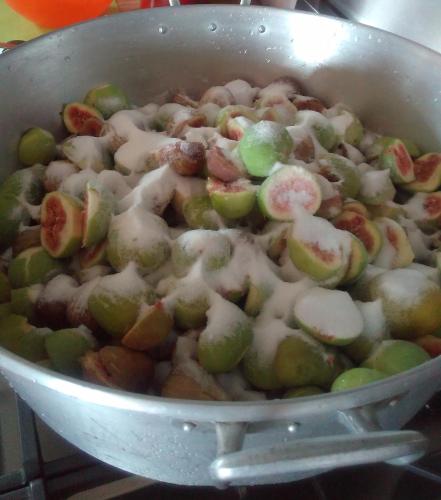 a pot of food with apples and cheese on it at La Forestière in Monclar-de-Quercy