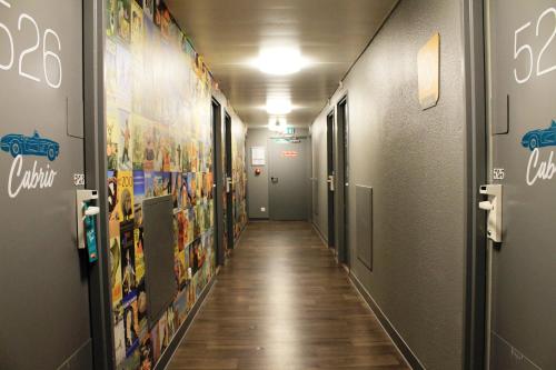a hallway with a long corridor with a long corridorngth at hotelF1 Paris Gennevilliers, 4 Rue Georges Corète 92230 Gennevilliers in Gennevilliers