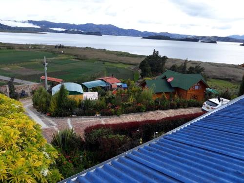 an aerial view of a house next to a lake at Villa Evelia in Aquitania