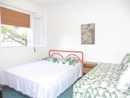 A bed or beds in a room at Appartamento Caravaggio