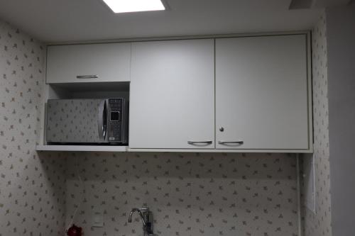 Dapur atau dapur kecil di Em frente ao mar Praia da Costa dias incríveis