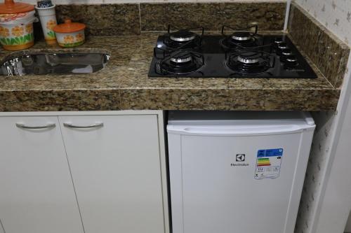 Dapur atau dapur kecil di Em frente ao mar Praia da Costa dias incríveis