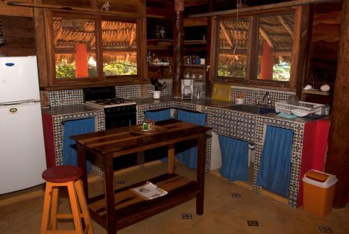 a kitchen with blue and white tile on the counters at Casa Cereza in Holbox Island