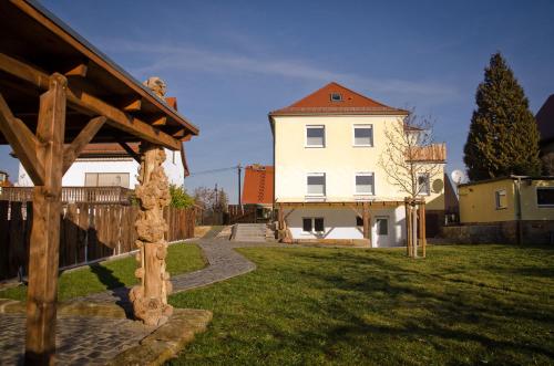 a large white house with a pathway in a yard at Villa Kreisel in Dresden