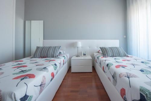מיטה או מיטות בחדר ב-Apartamento Mouzinho de Albuquerque