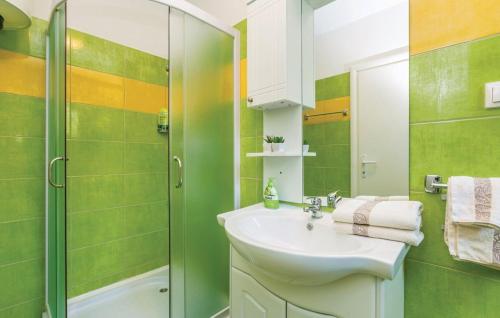 a bathroom with a sink and a shower at E&M in Senj
