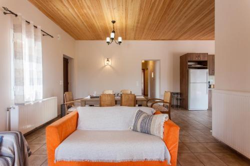 a living room with a couch and a table at Villa Vendema in Arménoi