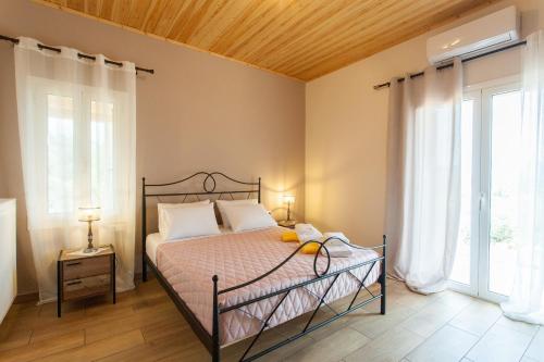 Ένα ή περισσότερα κρεβάτια σε δωμάτιο στο Villa Vendema