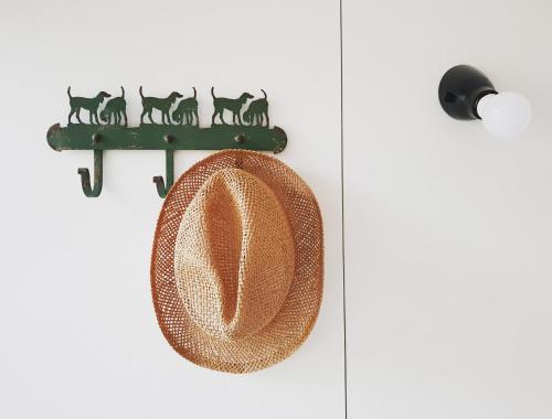 a sombrero is hanging on a door at Vakantiehuis ABEL in Dilsen-Stokkem