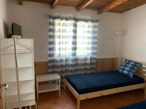 En eller flere senge i et værelse på Casa vacanze Villa Grace