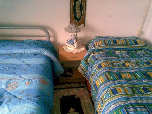 Postel nebo postele na pokoji v ubytování b&b palazzo neri
