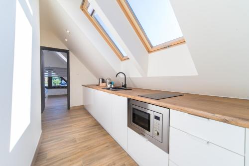 Dapur atau dapur kecil di Lilu Apartamenty
