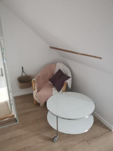 a room with a white table and a chair at Hos Mette in Børkop