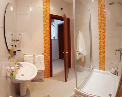 a bathroom with a shower and a sink and a toilet at Liliana Bol Apartment with Wonderful Sea View Near the Beaches in Bol