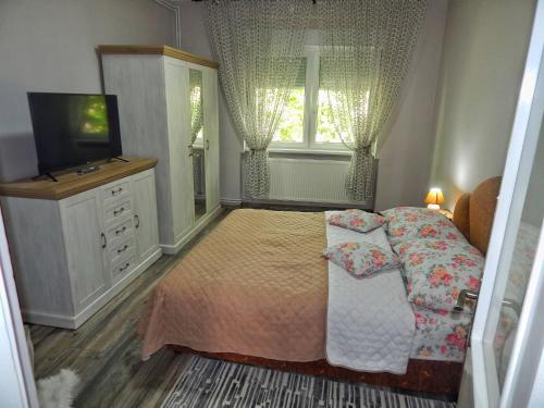 Postel nebo postele na pokoji v ubytování Apartman Centar