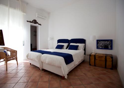 Ένα ή περισσότερα κρεβάτια σε δωμάτιο στο Maison Gioffredi