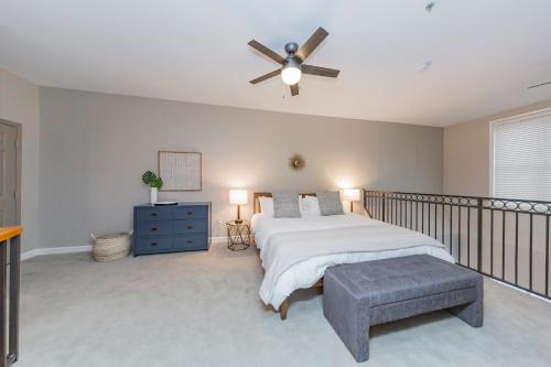 a bedroom with a bed and a ceiling fan at Mint House Nashville - Hillsboro Village in Nashville