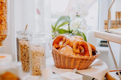 a basket of pretzels sitting on a table at Hotel Moorbadstuben in Bad Buchau