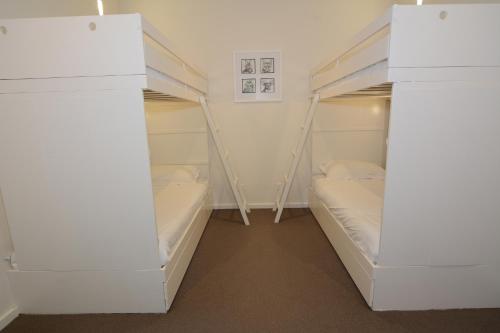 a room with two bunk beds and a tub at Apartment K2 06 in Mount Buller