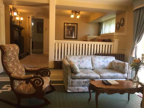 a living room with a couch and a table at Beaconsfield Bed and Breakfast - Victoria in Victoria