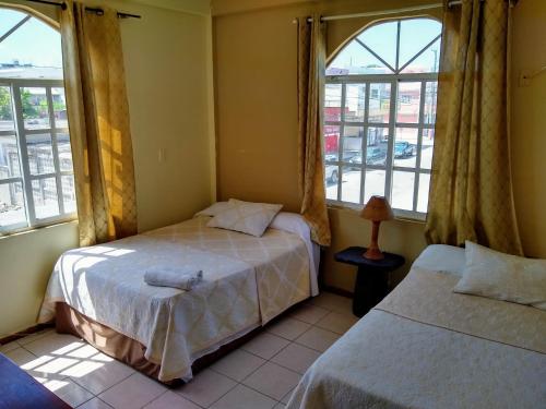 Una cama o camas en una habitación de Mirador Hotel